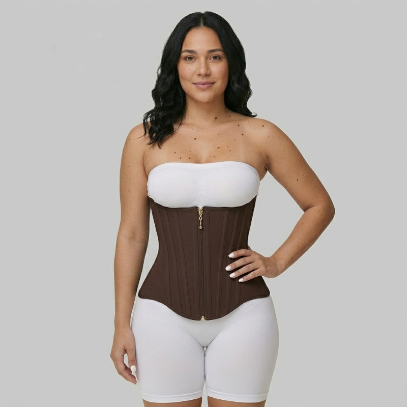 Woman wearing a brown and white waist trainer against a gray background